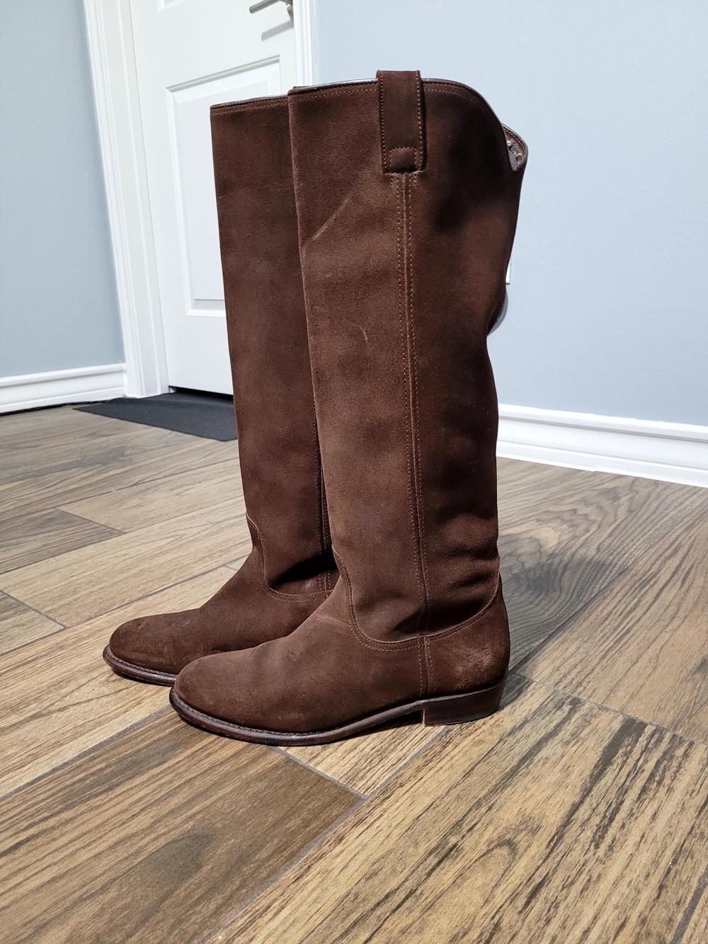 Frye below the knee pull-on style boots crafted from a rich brown suede material